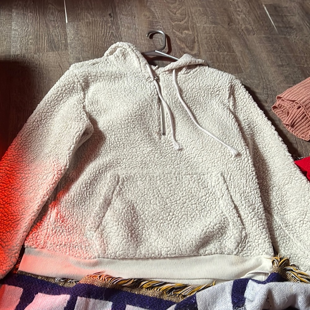 polyester sweater. it attracts lots stuff to it.